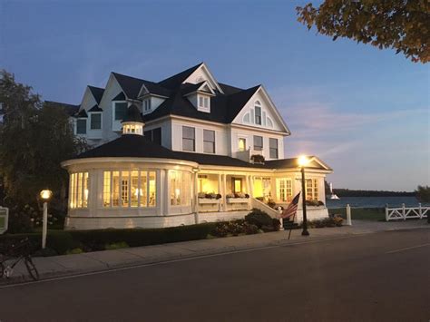 Elegant, waterfront hotel with room and suite accommodations, featuring inviting decor and an onsite restaurant. Hotel Iroquois, Mackinac Island, MI - Wander Jobs
