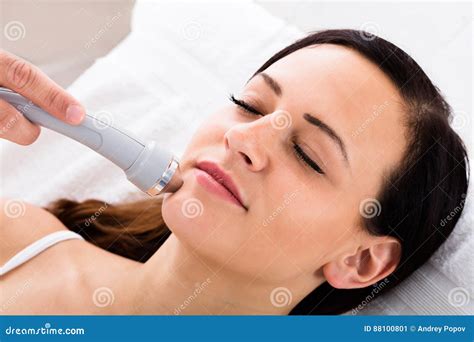 Woman Receiving Face Massage From Therapist Stock Image Image Of