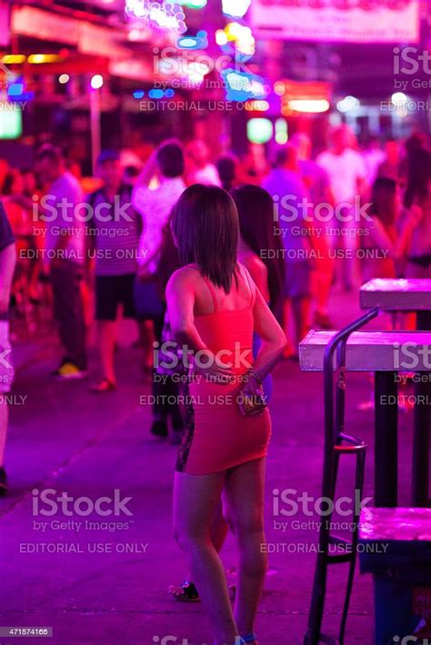 two pretty thai bar girls in dress are standing in red light street stock image everypixel