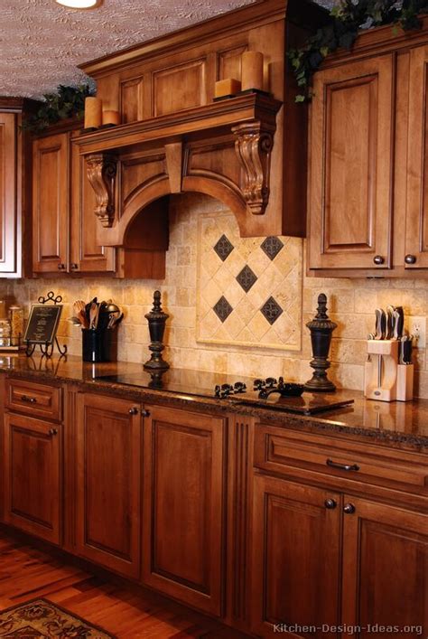 A tuscan kitchen showcases the beautiful features of an italian design with rich cabinetry, warm colors and plenty of natural stone materials. Tuscan Kitchen Design - Style & Decor Ideas