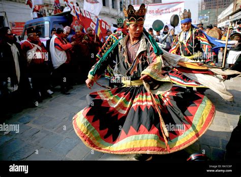 Nepalese Men From Ethnic Gurung Community In Traditional Attire Dance As They Take Part In