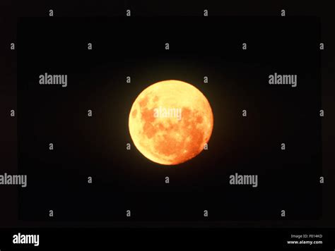 Orange Full Moon In Black Sky Stock Photo Alamy