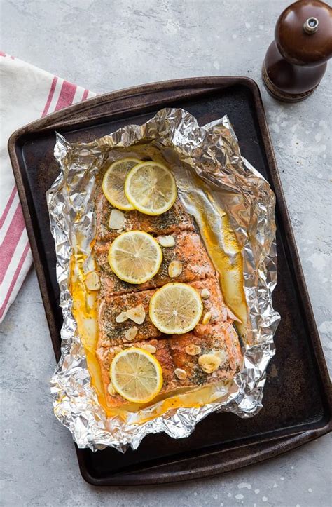 This delicious baked salmon is seasoned with olive oil, garlic, and thyme. How to Bake Salmon in Foil - The Roasted Root