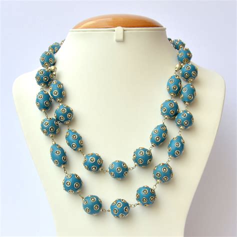 Handmade Necklace With Blue Beads Having Metal Balls And Rings Maruti Beads