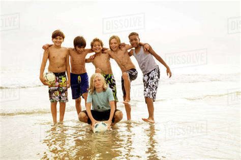 Portrait Of Boys 10 11 12 13 Standing On Beach Stock Photo Dissolve