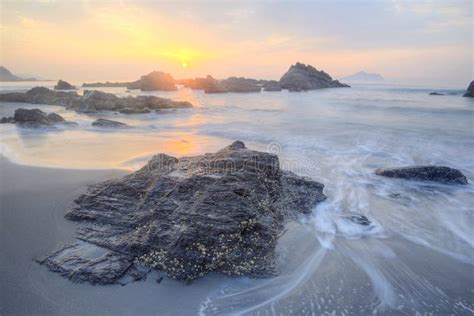 Beautiful Scenery Of Dawning Sky By Rocky Seashore In Northern Taiwan