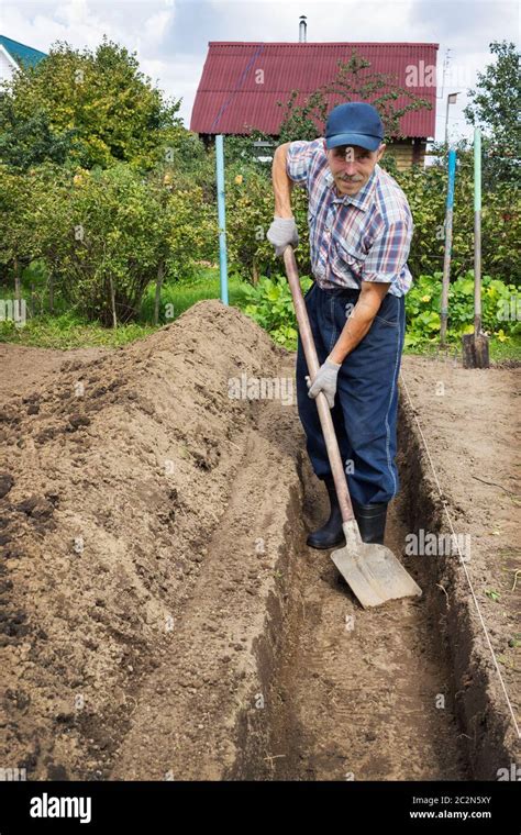 Old Man Digging Ground Hi Res Stock Photography And Images Alamy