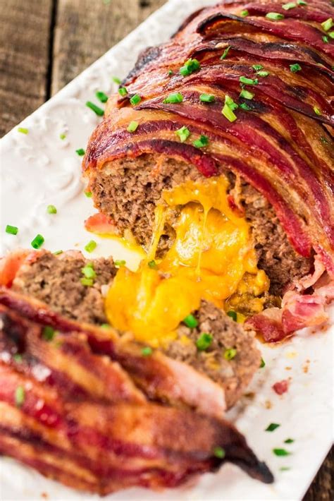 Made with a ground beef mixture, brown sugar and ketchup glaze, all wrapped in bacon. Bacon Wrapped Cheese Stuffed Meatloaf - Olivia's Cuisine
