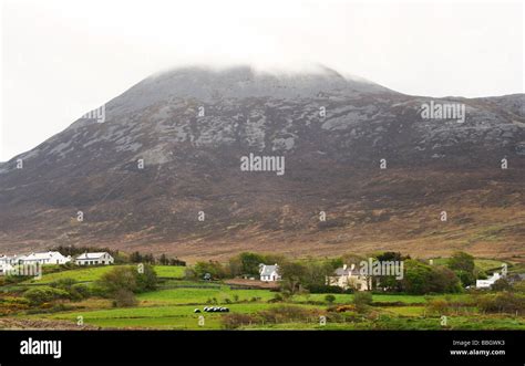 Croagh Patrick Mountain Top Covered In Cloud Cottages And Farmland
