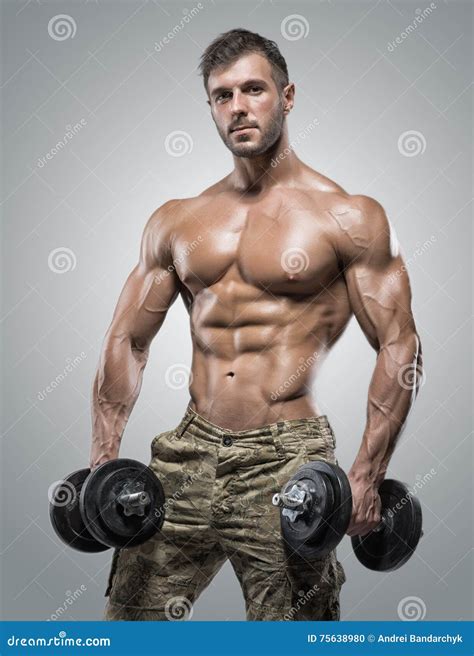 Muscular Athlete Bodybuilder Man On A Gray Background Stock Photo Image Of Healthy Fitness