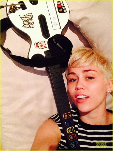 Miley Cyrus Skips Grammys Plays Guitar Hero Instead Photo Photo 3041603 00 Photos Just