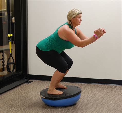 Try This How To Do A Bosu Ball Squat Abc Fitness Studio