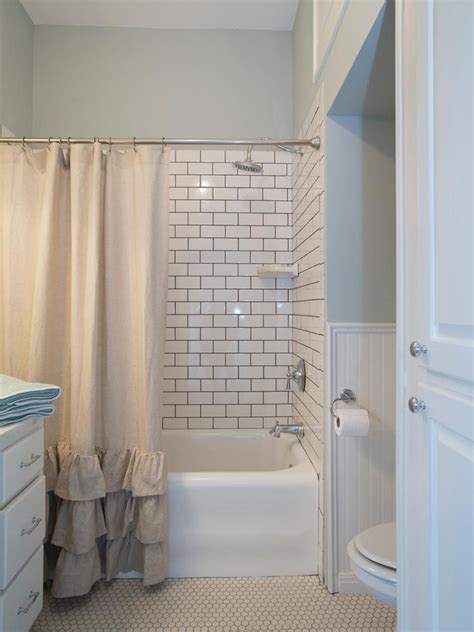 That black tiles defined the area really well with subway tiles on the bottom half and paint on the other. Fixer Upper's Best Bathroom Flips | Beadboard wainscoting ...