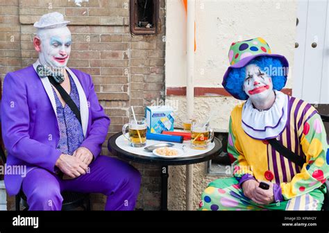 Two Clowns Having A Beer Stock Photo Alamy