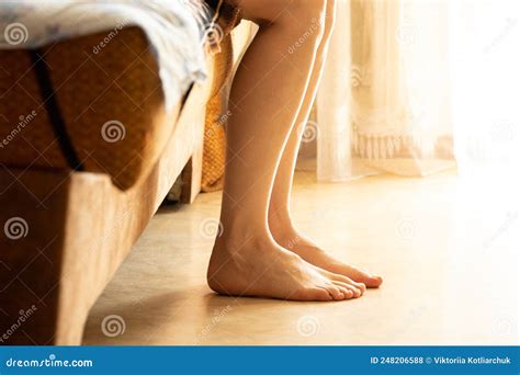 womenand x27 s bare feet on the floor near the sofa in the sun bare feet on the floor sit on the