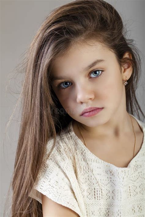 Portrait Of A Charming Brunette Little Girl Stock Image Image Of Grey