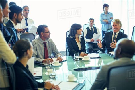 Large Group Of Business People Having Meeting In Conference Room