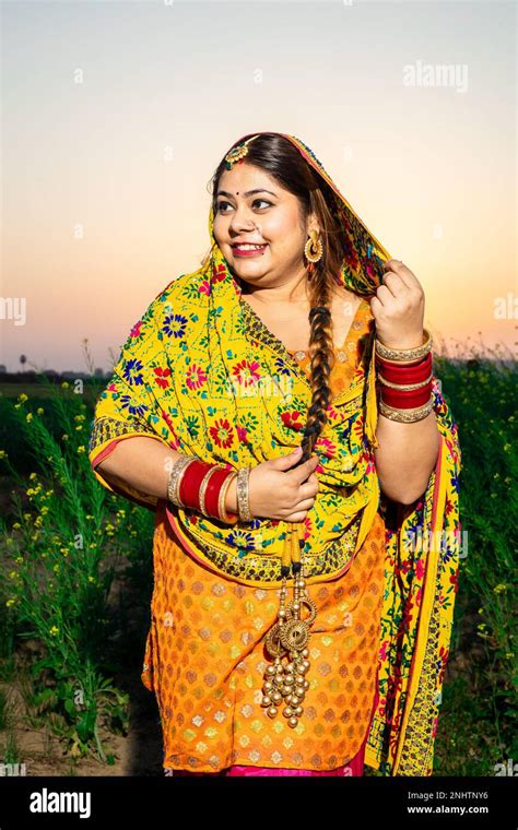 Portrait Of Beautiful Young Indian Punjabi Woman Wearing Colorful