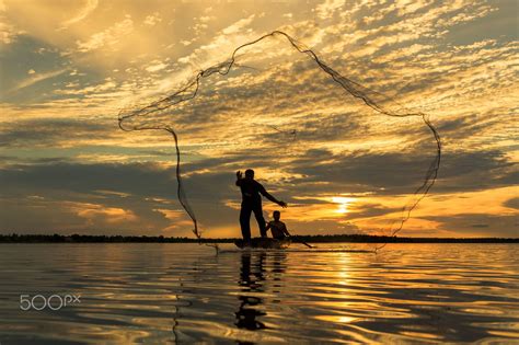 Asianfisherman Sunset Two Fisherman On The Boat In Lake At