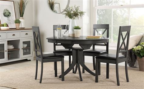 See more ideas about dining room decor, dining, solid wood dining set. Hudson Round Grey Wood Extending Dining Table with 4 Kendal Chairs (Black Leather Seat Pad ...