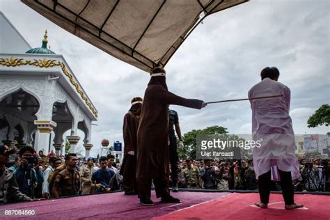 Indonesian Gay Couple Sentenced To Public Caning In Aceh Photos Et