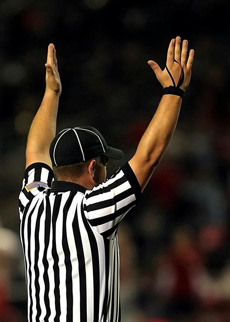 Referee Raising Both Hands · Free Stock Photo