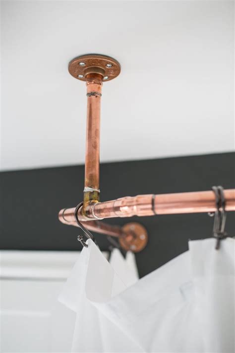 I created copper curtain rods to use throughout my tiny house. A DIY copper curtain rod completes this custom black and ...