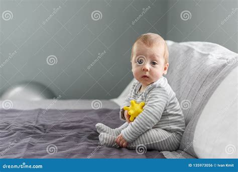 Sitting Baby Boy On Grey Carpet Closeup Stock Photo Image Of Portrait