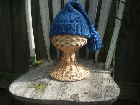 French Trapper Knit Hat | AllFreeKnitting.com Petal french style pillbox cocktail hat with an ivory hand blocked base.