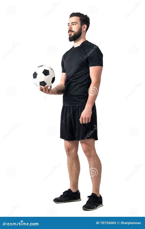 Football Or Soccer Futsal Player Holding Ball In One Hand Looking Up