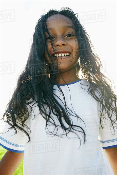 Portrait Of Smiling Mixed Race Girl With Long Hair Stock Photo Dissolve