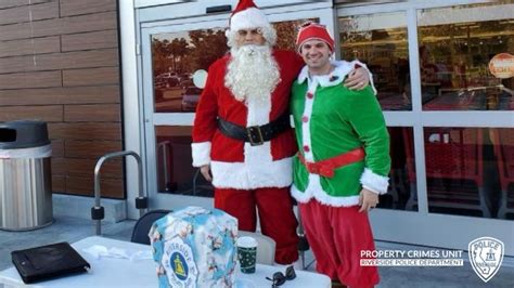 Undercover Police Officers Dressed As Santa Claus And His Elf Stop