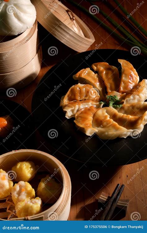 Cropped Shot Of Dim Sum With Gyoza And Bun Served On Traditional