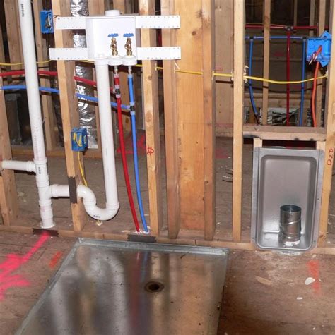The hot/cold water and drainage hose. Wall recessed laundry feed/drain plumbing lines and ...