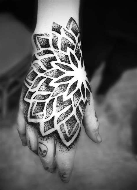 stunning mandala dotwork hand tattoo