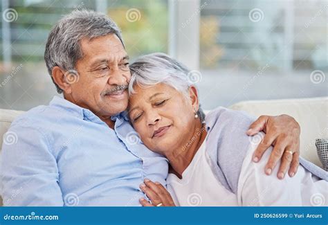 Closeup Of An Affectionate Mixed Race Senior Couple Relaxing In Their