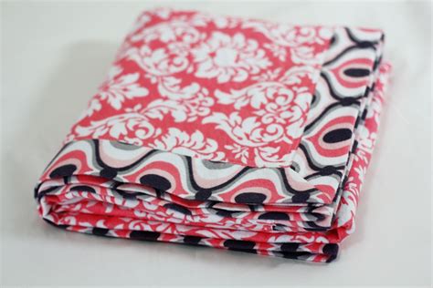 If you have a serger, use the rolled hem setting to stitch around all the edges. Self Binding Receiving Blanket Tutorial - Sew Much Ado