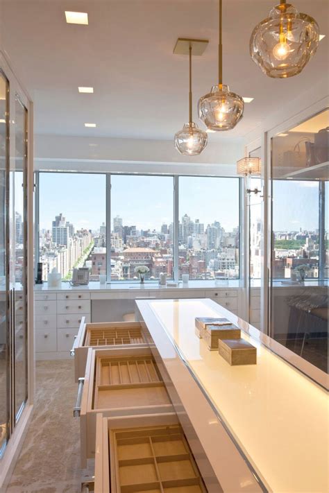 A popular design trend over the last few years has transformed the master bedroom walk in closet. Jewelry Island in a plush, contemporary Park Avenue ...
