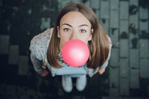 Young Teenage Girl Blowing Pink Bubble Gum High Quality People Images