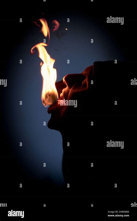 A Fire Eater Performs His Act On Stage As Part Of The Kandyan Dance