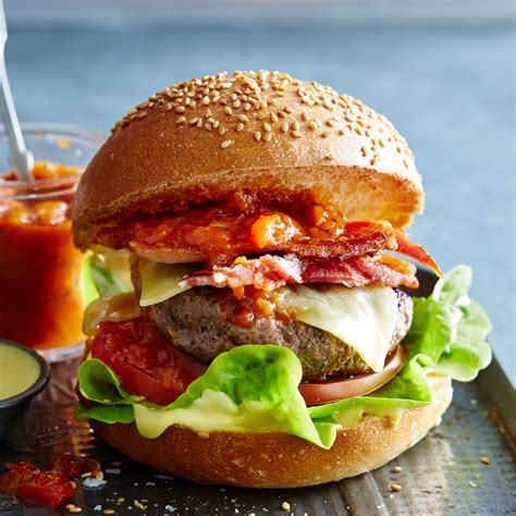 Firstly, beef patty is prepared by chopping and mixing together minced beef, onion, chilies, spices, lemon juice, sesame seeds, egg, bread crumbs. Homemade Beef Burger Recipe