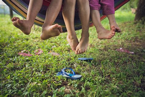 Barefoot Children On A Swing By Dejan Ristovski
