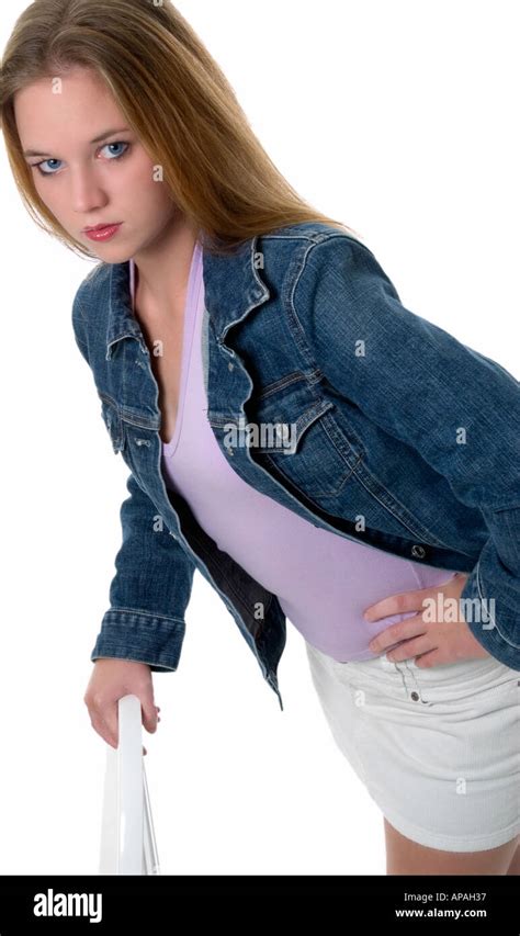 Teen Caucasian Girl Wearing Blue Jean Jacket And White Shorts High