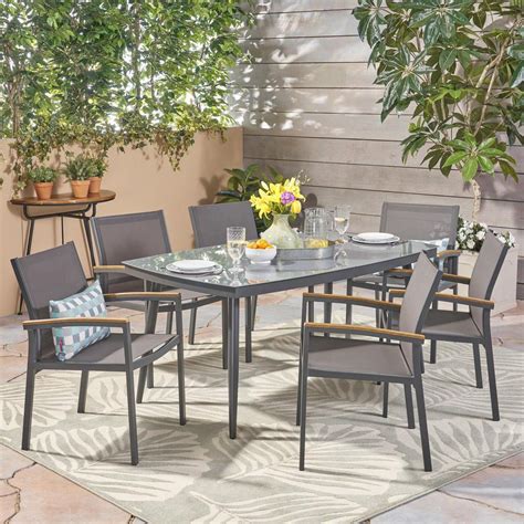 This centrepiece pedestal table with its clean lines and contemporary look can seat up to 6 people. Noble House Liverpool Gray 7-Piece Aluminum Outdoor Dining ...
