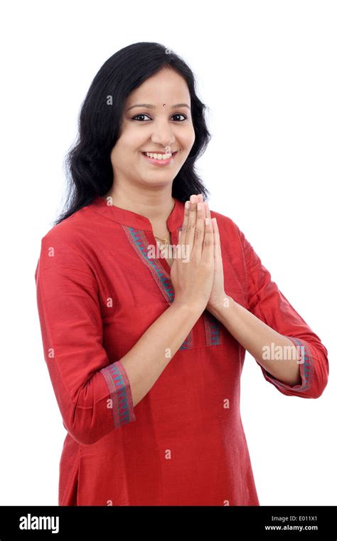 Smiling Young Woman Greeting Namasthe Against White Background Stock