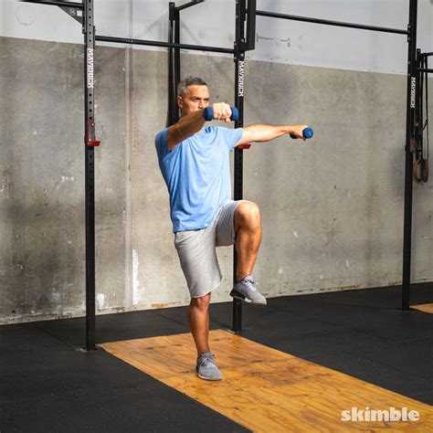 Lateral Lunge And Shoulder Raise Exercise How To Workout Trainer By