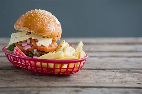 Cheeseburger And French Fries In Basket Stock Photo Image Of Fried