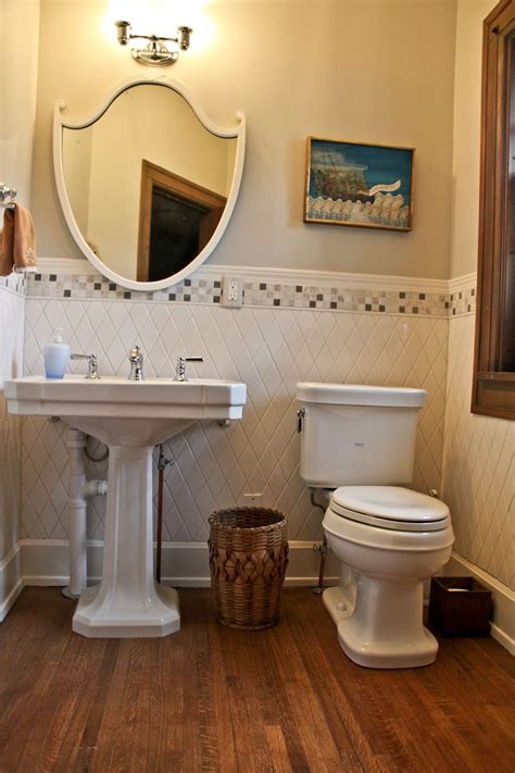 While glossy tiles and polished stone can look very luxurious, skip these materials for bathroom flooring.the sheen of these surfaces are slick to the touch. Half Bath- tile on wall and wood floor | Bathrooms remodel ...