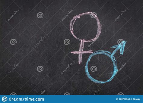 Male And Female Gender Symbols On A Black Background Stock Photo