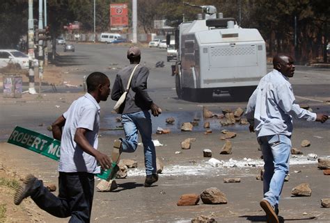 Police In Zimbabwe Hit Protesters With Batons Tear Gas And Water